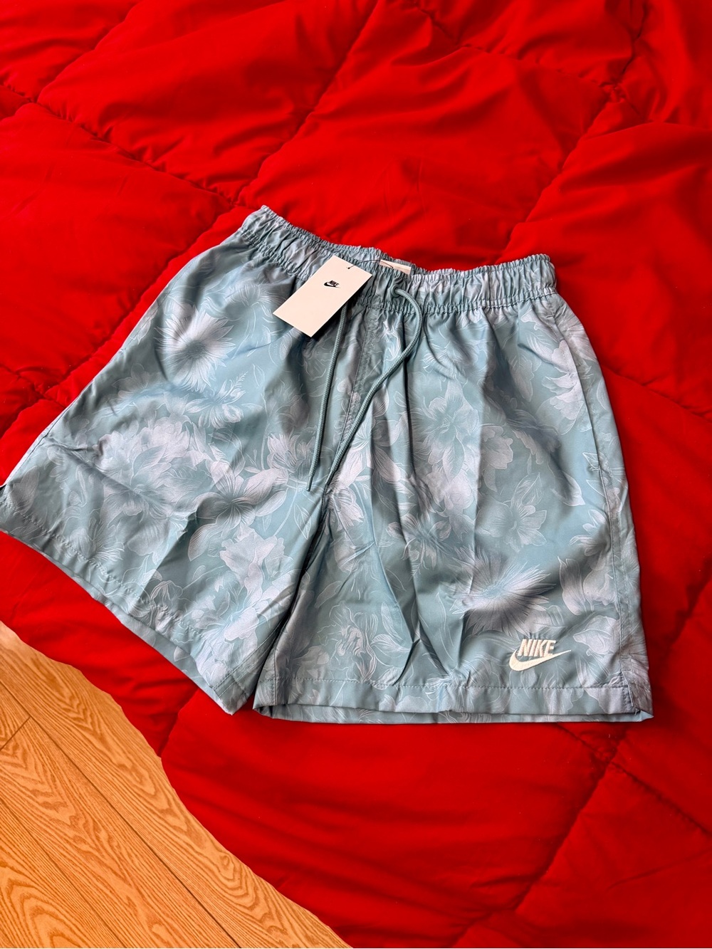 Nike Light Blue Floral Swim Shorts with White Logo